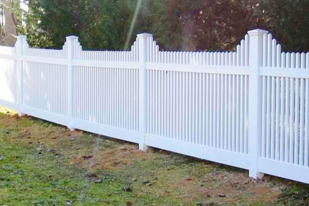 white vinyl scalloped picket fence